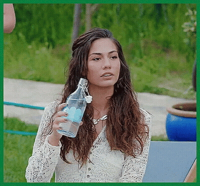 Woman White Lace Top Holding Clear Water Bottle GIF