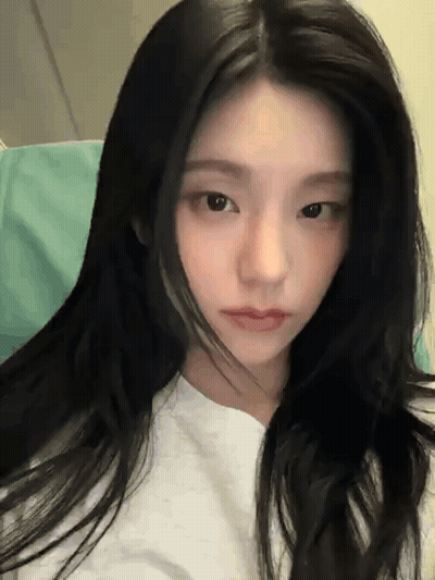 Woman White Shirt Long Black Hair Looking Camera GIF