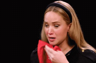 Woman Wipes Face With Red Cloth Saying What Do GIF