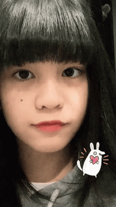 Woman Wiping Forehead In Pink Top GIF