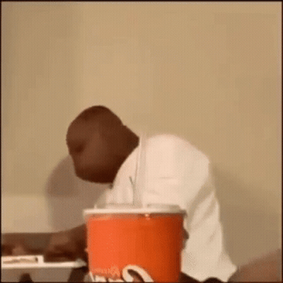 Woman With Afro In Tan Shirt GIF