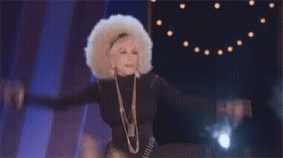 Woman With Afro Wig Dancing On Stage GIF