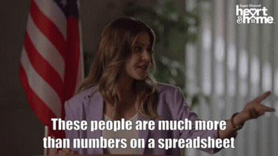 Woman With American Flag Saying People Are More Than Numbers GIF