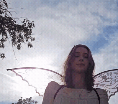 Woman With Angel Wings By Tree GIF