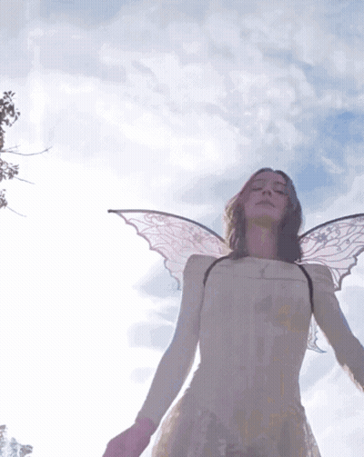 Woman With Angel Wings In White Dress Blue Sky GIF