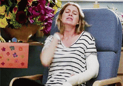 Woman With Arm Cast Sitting In Chair GIF