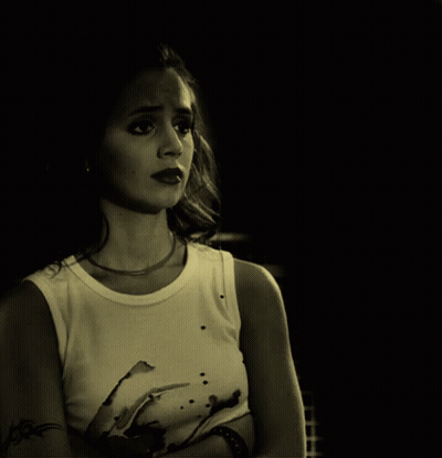 Woman With Arm Tattoo In White Tank Top GIF