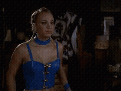 Woman With Arms Outstretched Holding Light GIF