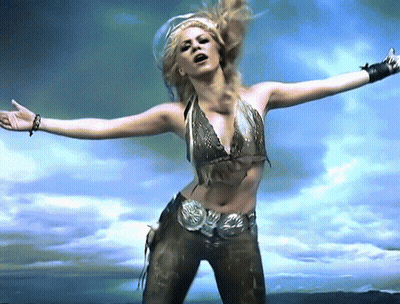Woman With Arms Outstretched In Blue Sky GIF
