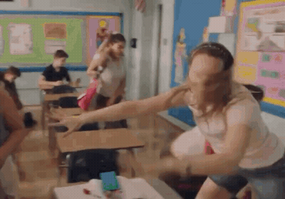 Woman With Arms Outstretched In Classroom GIF