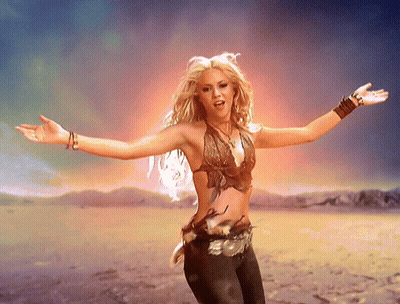 Woman With Arms Outstretched In Desert GIF