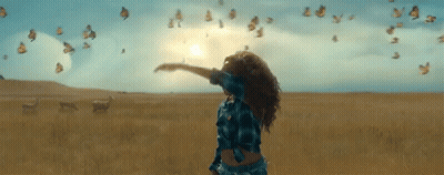 Woman With Arms Outstretched Surrounded By Butterflies GIF
