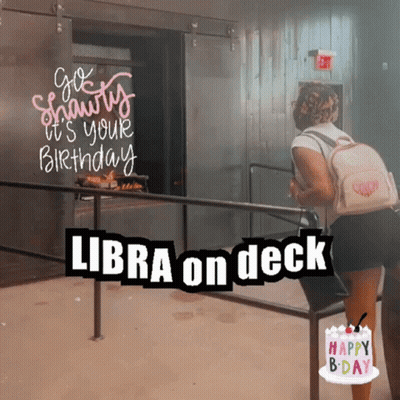 Woman With Backpack In Front Of Elevator Sign Libra On Deck GIF
