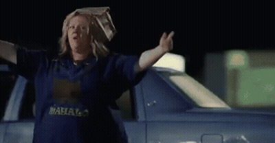 Woman With Bag On Head Walking At Night GIF