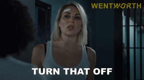 Woman With Bandage In Front Of Turn Off Sign GIF