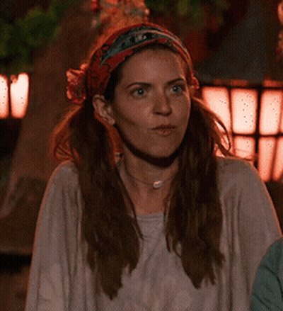 Woman With Bandana And Necklace Looks Serious GIF
