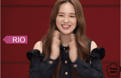 Woman With Bangs And Striped Shirt Making Funny Face GIF