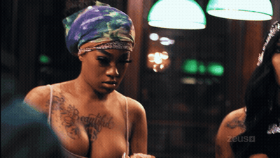 Woman With Beautiful Chest Tattoo Looking In Mirror GIF