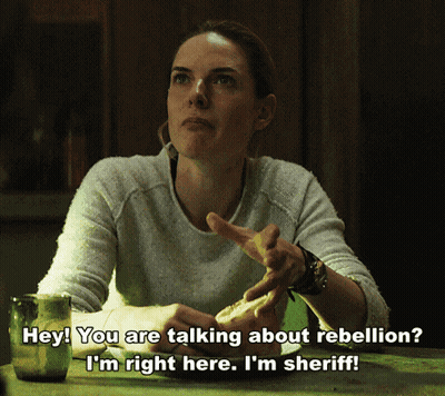 Woman With Beer And Sandwich Talking About Rebellion GIF