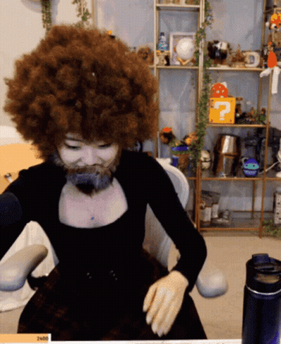 Woman With Big Afro And Beard At Microphone GIF