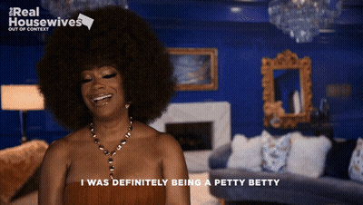 Woman With Big Afro Smiling I Was Definitely Being A Petty Betty GIF