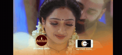 Woman With Bindi On Forehead And Man Behind Her GIF