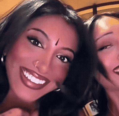Woman With Bindi Smiling Beside Another Woman GIF