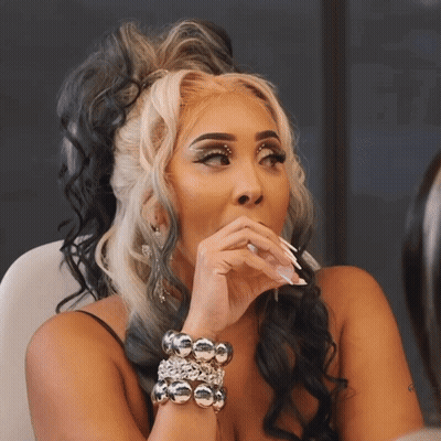 Woman With Black And White Hair Wearing Silver Bracelet GIF