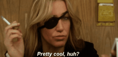 Woman With Black Eye Patch Smoking Cigarette Saying Pretty Cool Huh GIF
