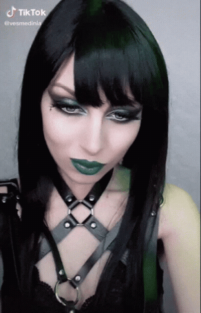 Woman With Black Hair And Green Lipstick TikTok Watermark GIF