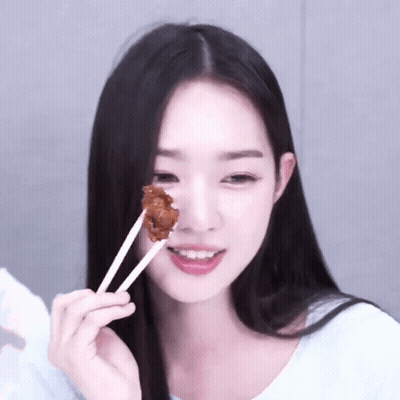 Woman With Black Hair Eating Meat With Chopsticks GIF