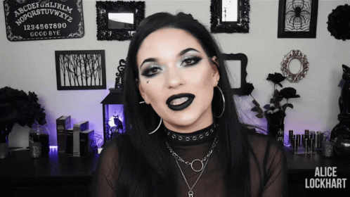 Woman With Black Lipstick At Ouija Board GIF