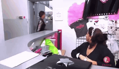 Woman With Black Purse In Theater GIF