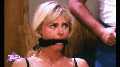 Woman With Black Scarf Held By Man GIF