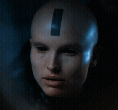 Woman With Black Stripe On Forehead Looking At Camera GIF
