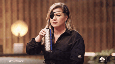 Woman With Blindfold Holding Soda And Water Bottle GIF