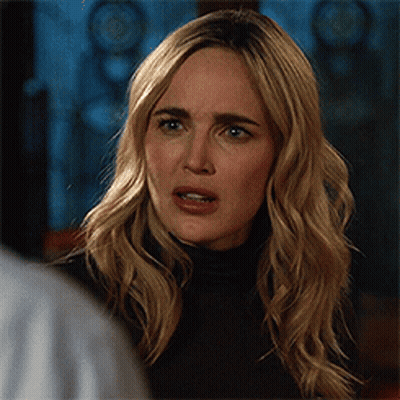 Woman With Blonde Hair And Black Turtleneck GIF