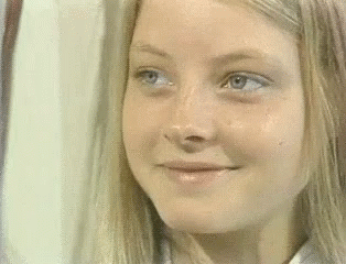Woman With Blonde Hair And Blue Eyes Smiling GIF