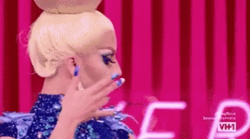Woman With Blonde Hair And Blue Nails GIF