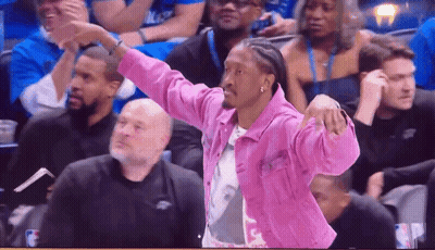 Woman With Blonde Hair And Pearl Necklace Near Stop Touching Sign GIF