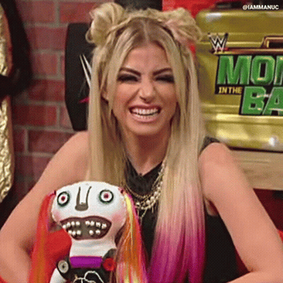Woman With Blonde Hair And Pink Highlights Smiling Holding Stuffed Animal GIF