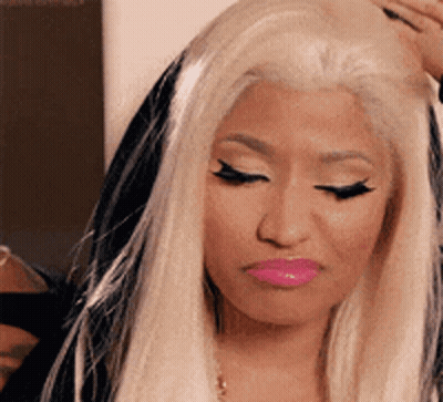 Woman With Blonde Hair And Pink Lips Close Up GIF