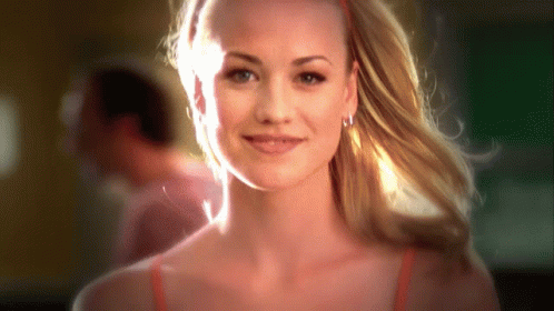 Woman With Blonde Hair And Red Headband Smiling GIF