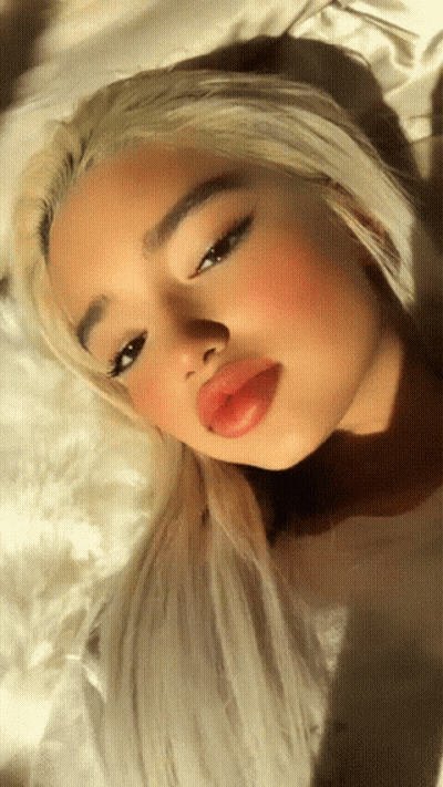 Woman With Blonde Hair And Red Lips Close Up GIF