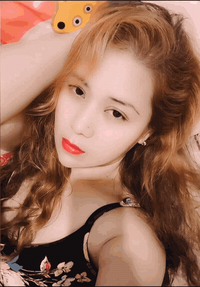 Woman With Blonde Hair And Red Lipstick Lying GIF