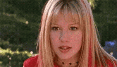 Woman With Blonde Hair And Red Streaks GIF