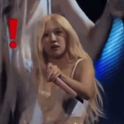 Woman With Blonde Hair Holding Pink Microphone GIF