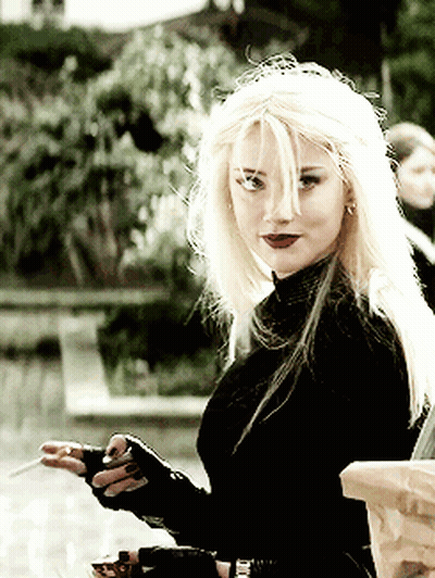 Woman With Blonde Hair In Black Top GIF