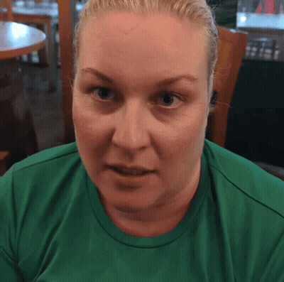 Woman With Blonde Hair In Green Shirt GIF