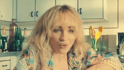 Woman With Blonde Hair In Kitchen GIF